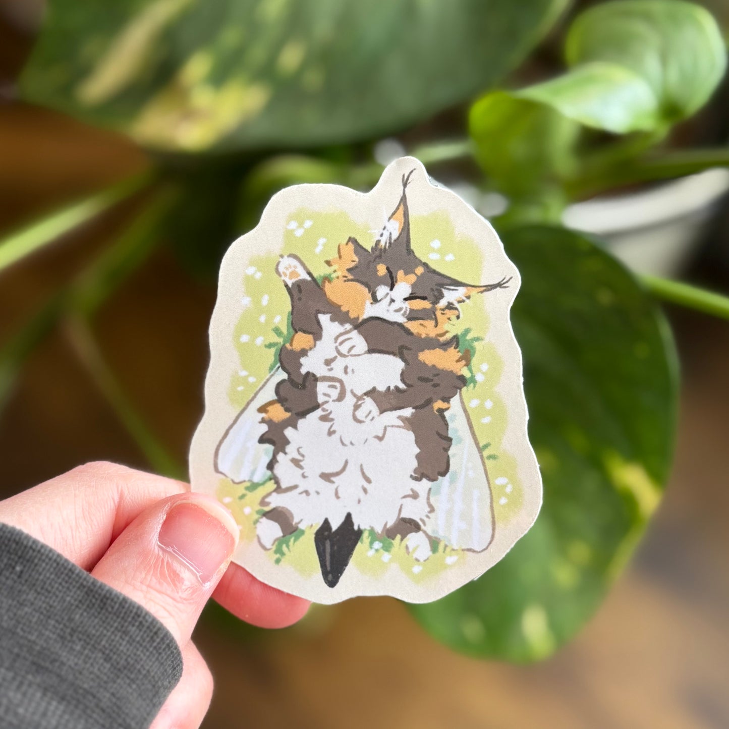 Teemo the beecat laying in grass sticker